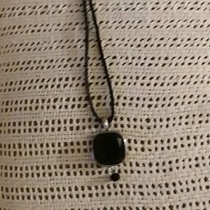 Necklace with black and silver pendant